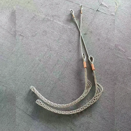 Two heavy duty wire mesh cable pulling socks ready for a duct pull on site