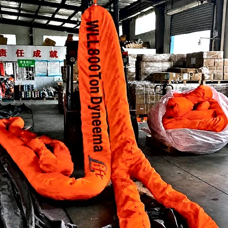 WLL 800T Dyneema round sling marked WLL800Ton Dyneema on a factory floor beside packed slings