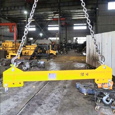 10 tonne dual crane lifting beam marked with its rated capacity, hung in a workshop