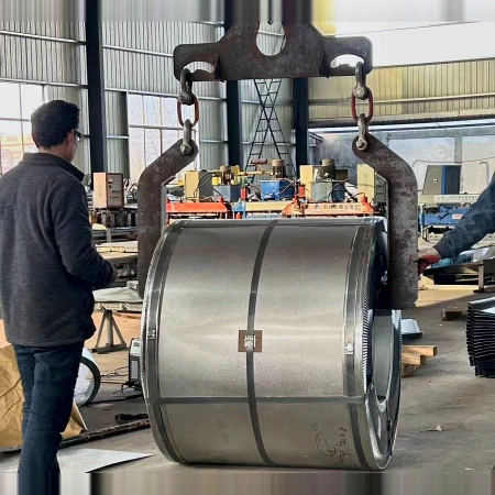 Double leg two-sided coil lifter holding a steel coil with the axis horizontal in a workshop
