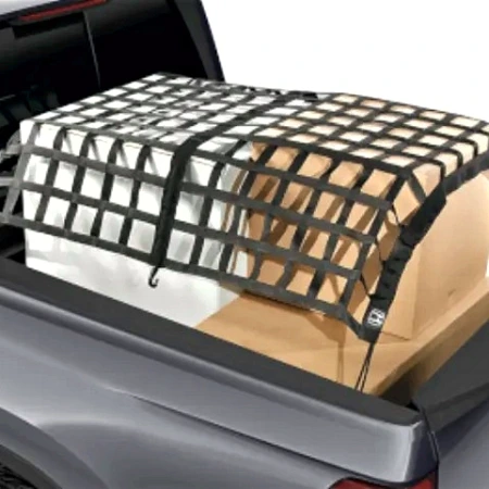 Black truck cargo net over cartons in the bed of a grey pickup truck