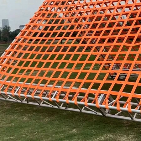 Orange climbing net laced along the tubes of a galvanised steel A-frame