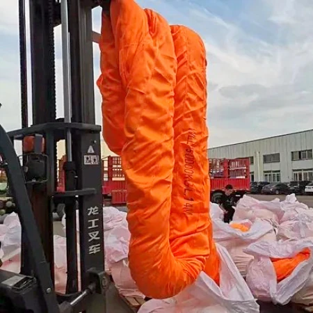 Heavy duty orange round sling coil being moved by a forklift at the factory